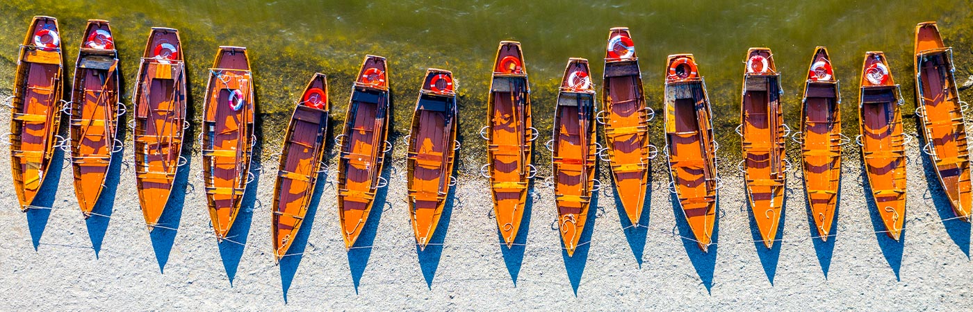 Looking down on a line of rowing boats