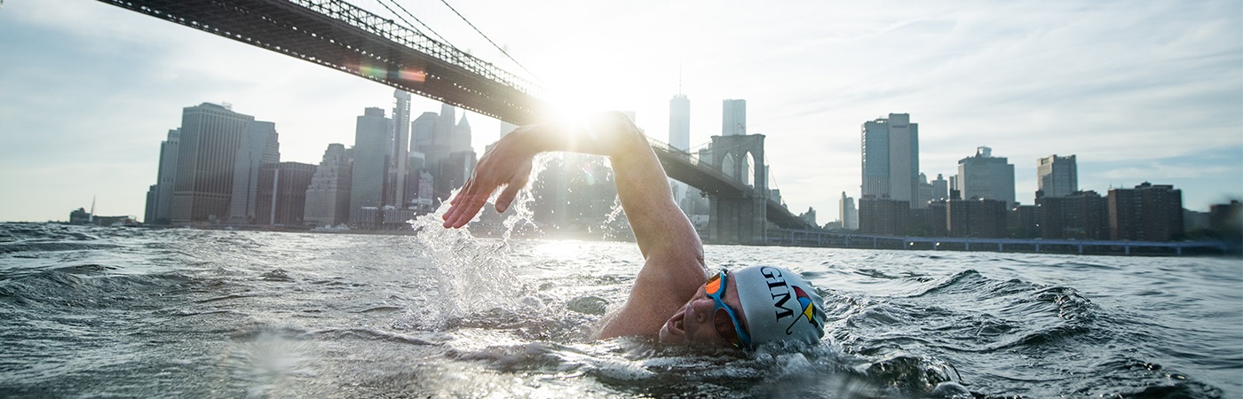 Lewis Pugh swimming under the Brooklyn Bridge, NYC