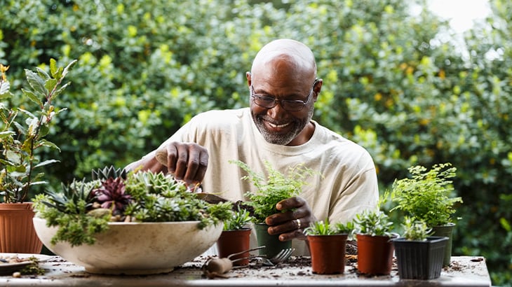 Happy man gardening