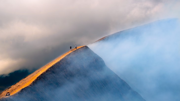 People on top of a mountain peak