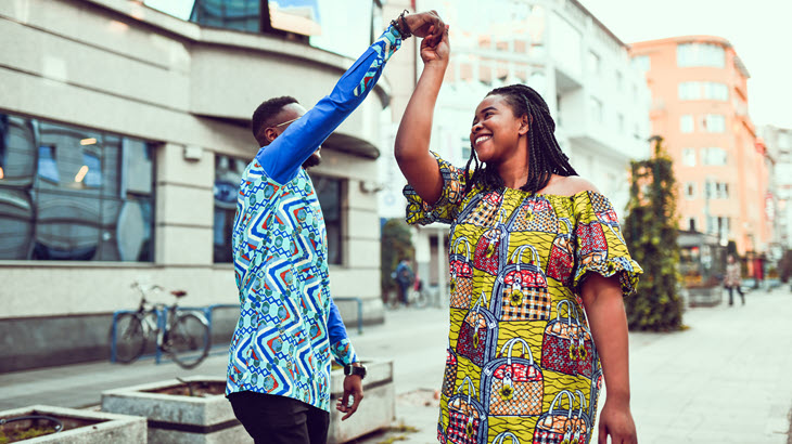 two people dancing in the street